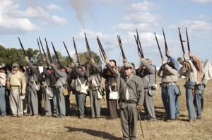 Living history reenactors fire rifles 