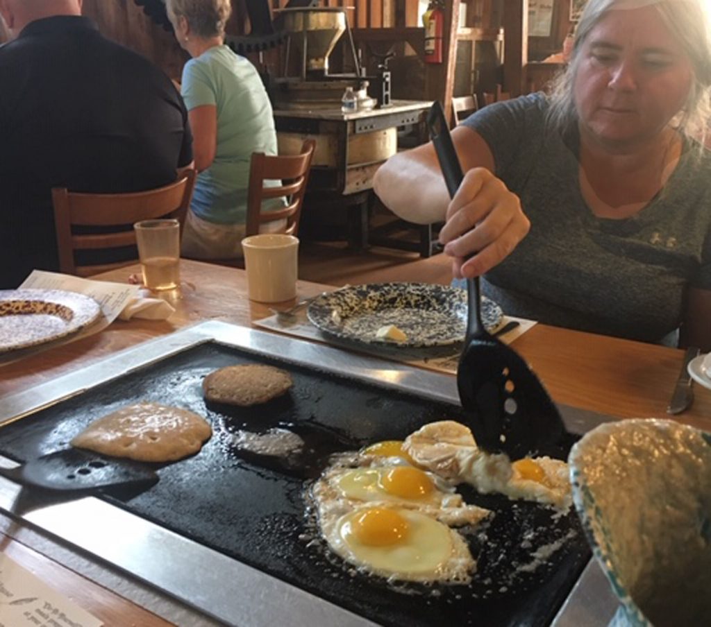 Description: Macintosh HD:Users:lucytobias:Desktop:IMG_2264.JPG
a Real Floridian cooks pancakes at the Old Spanish Mill in DeLeon Springs state park
